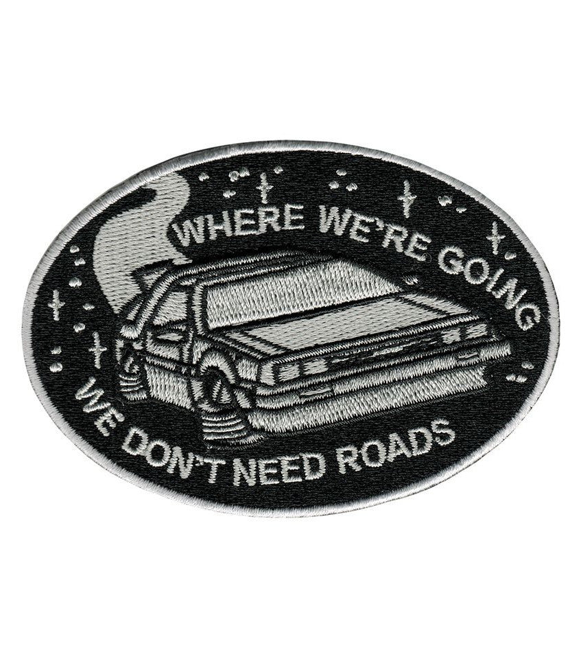 iron on embroidered patch with a design of Back to The Future and the slogan "where we're going we don't need roads" - Fun 80s 90s movie accessories
