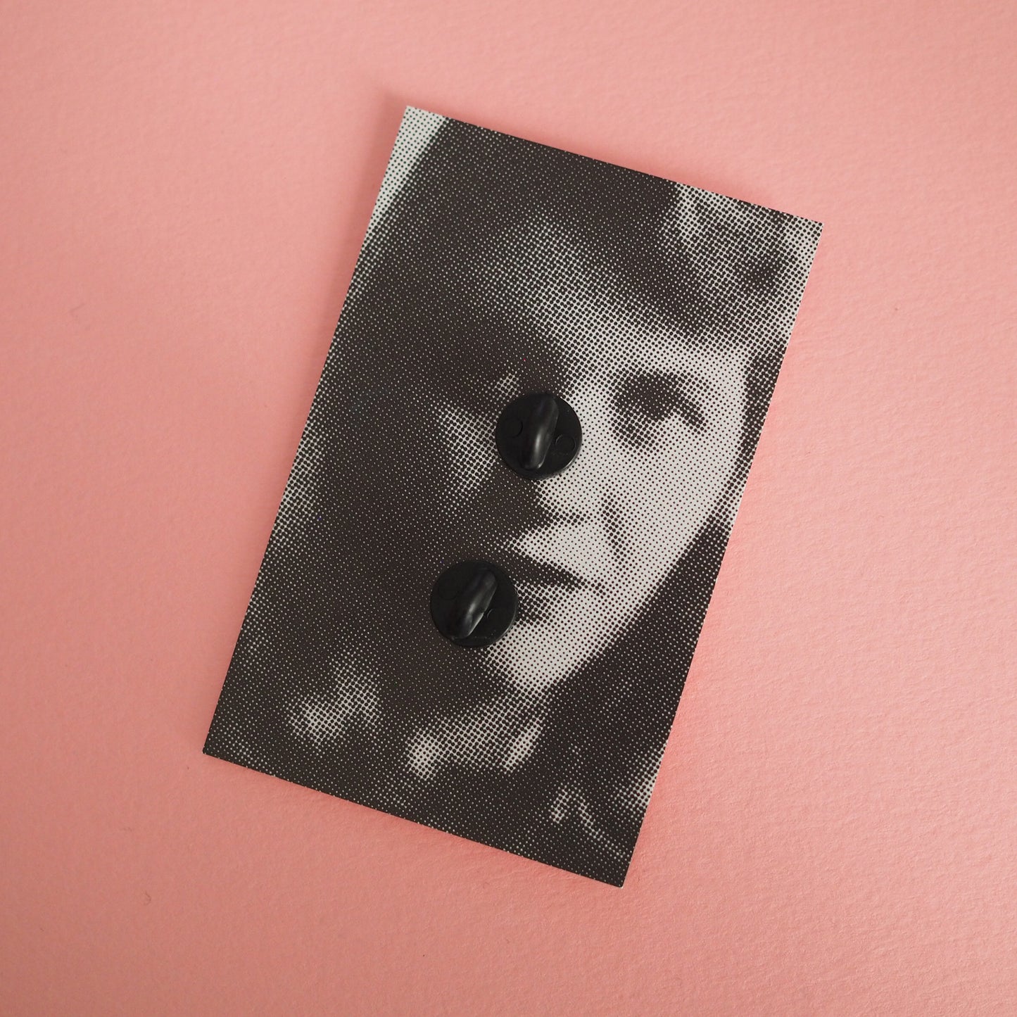 Back card of the enamel pin featuring a portrait of Sylvia Plath - Feminist Poet Writer