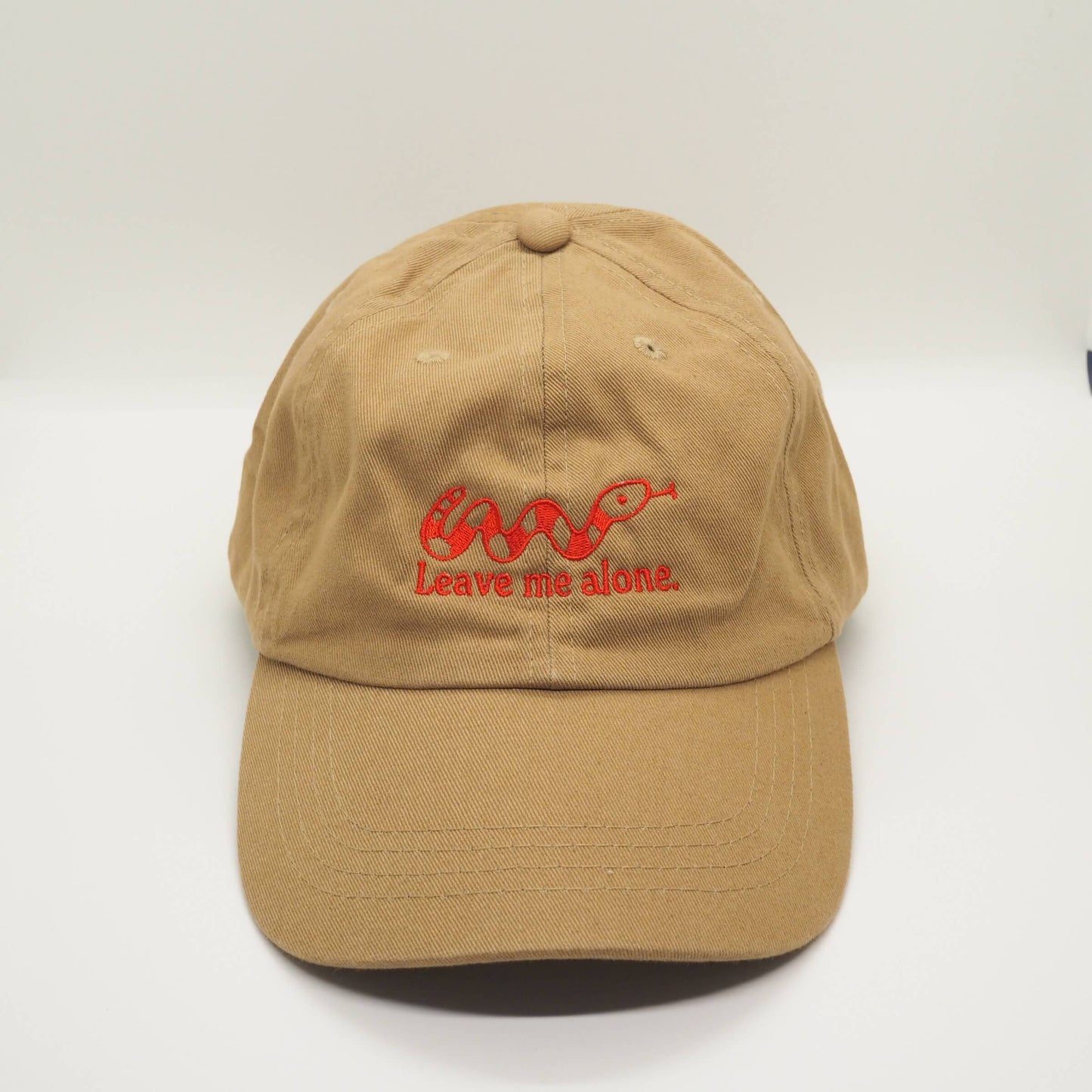 Embroidered Camel Brown Cotton Cap with Snake design and the slogan Leave me alone. Streetwear Punk Fun Accessories