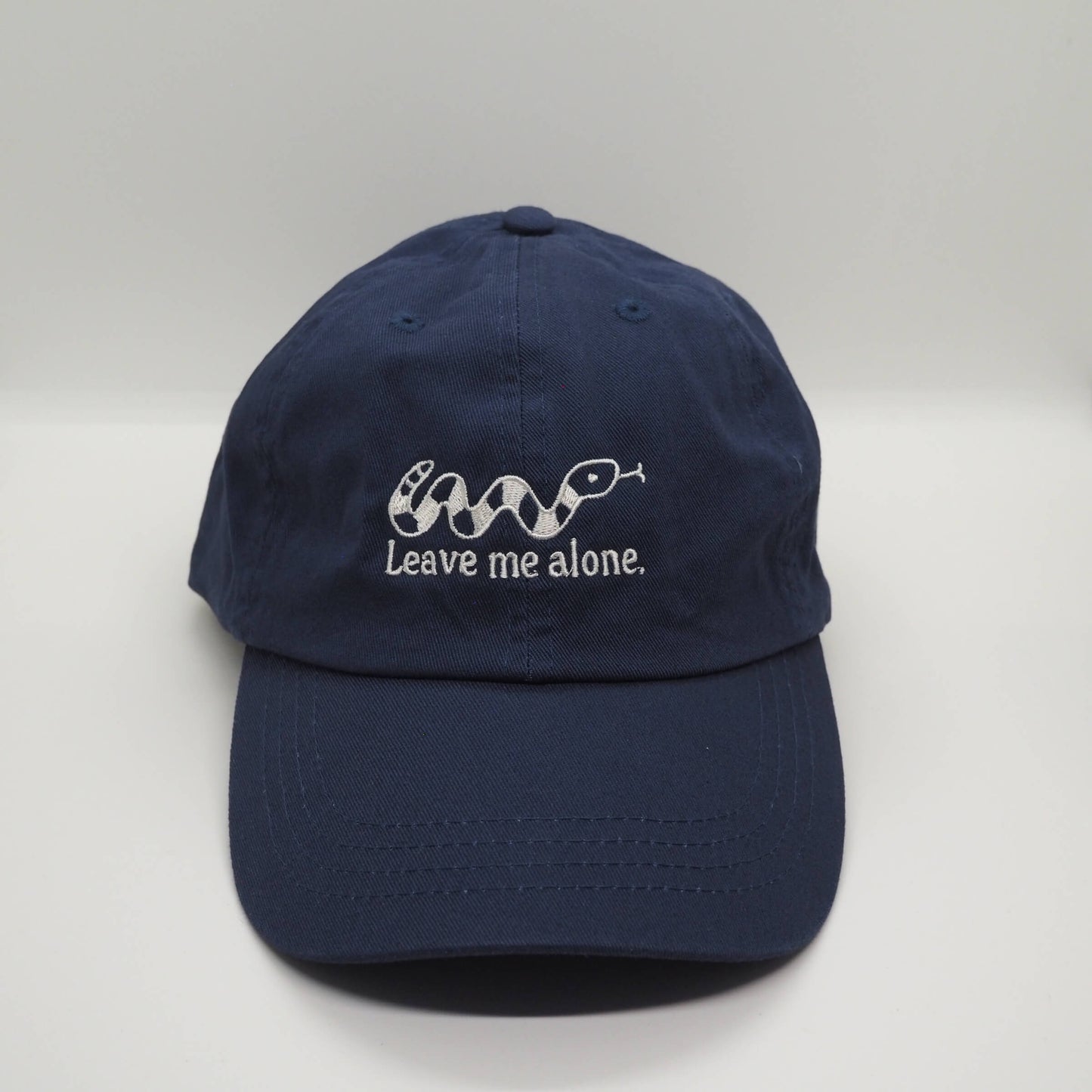 Embroidered Navy Blue Cotton Cap with Snake design and the slogan Leave me alone. Streetwear Punk Fun Accessories