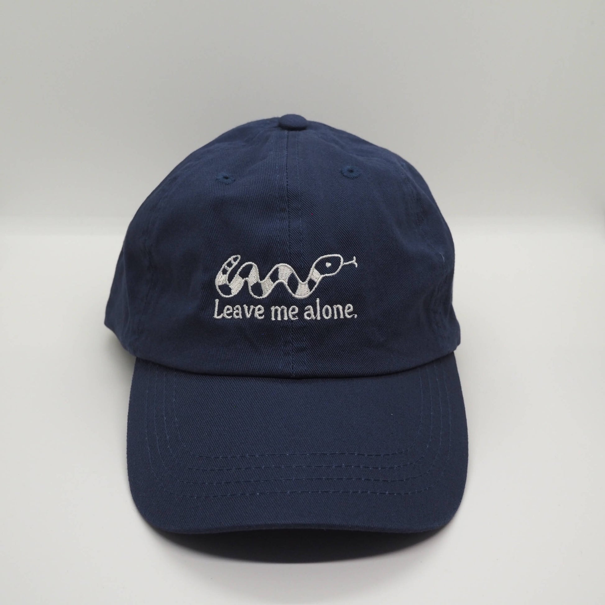 Embroidered Navy Blue Cotton Cap with Snake design and the slogan Leave me alone. Streetwear Punk Fun Accessories