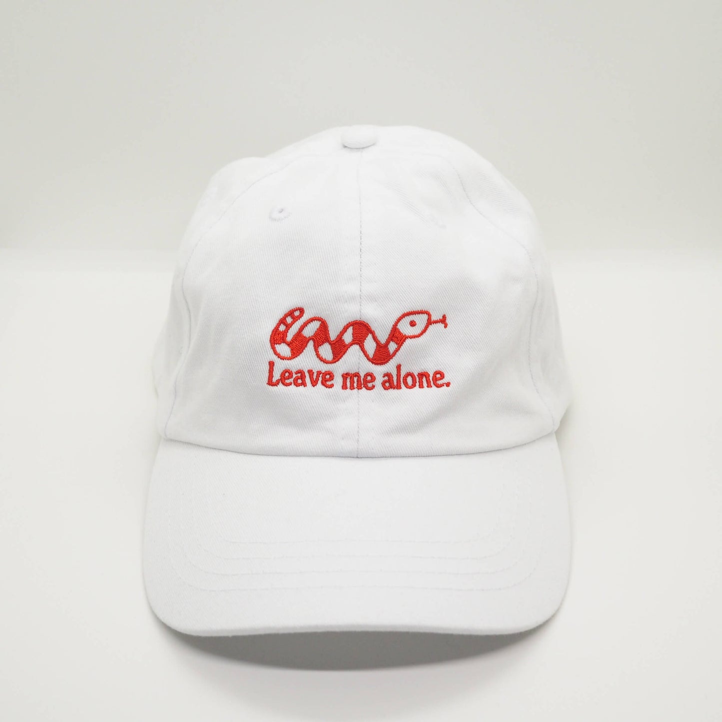 Embroidered White Cotton Cap with Snake design and the slogan Leave me alone. Streetwear Punk Fun Accessories